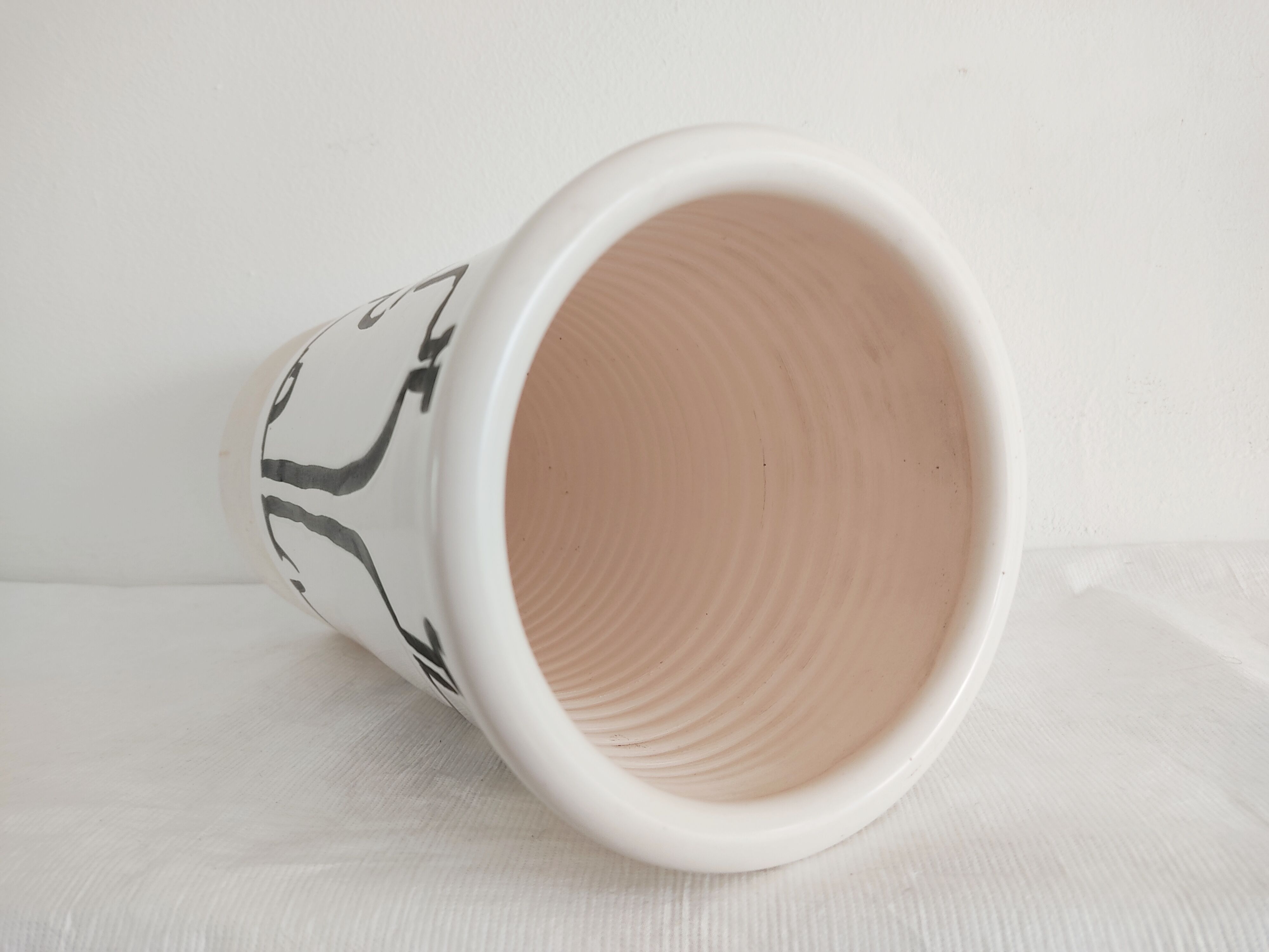 Vase decorated in hollows of bottles and glasses