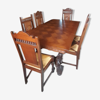 Breton dining room table with 2 extensions and 6 chairs with carved Breton characters