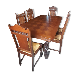 Breton dining room table with 2 extensions and 6 chairs with carved Breton characters