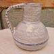 Old stamped glazed terracotta jug