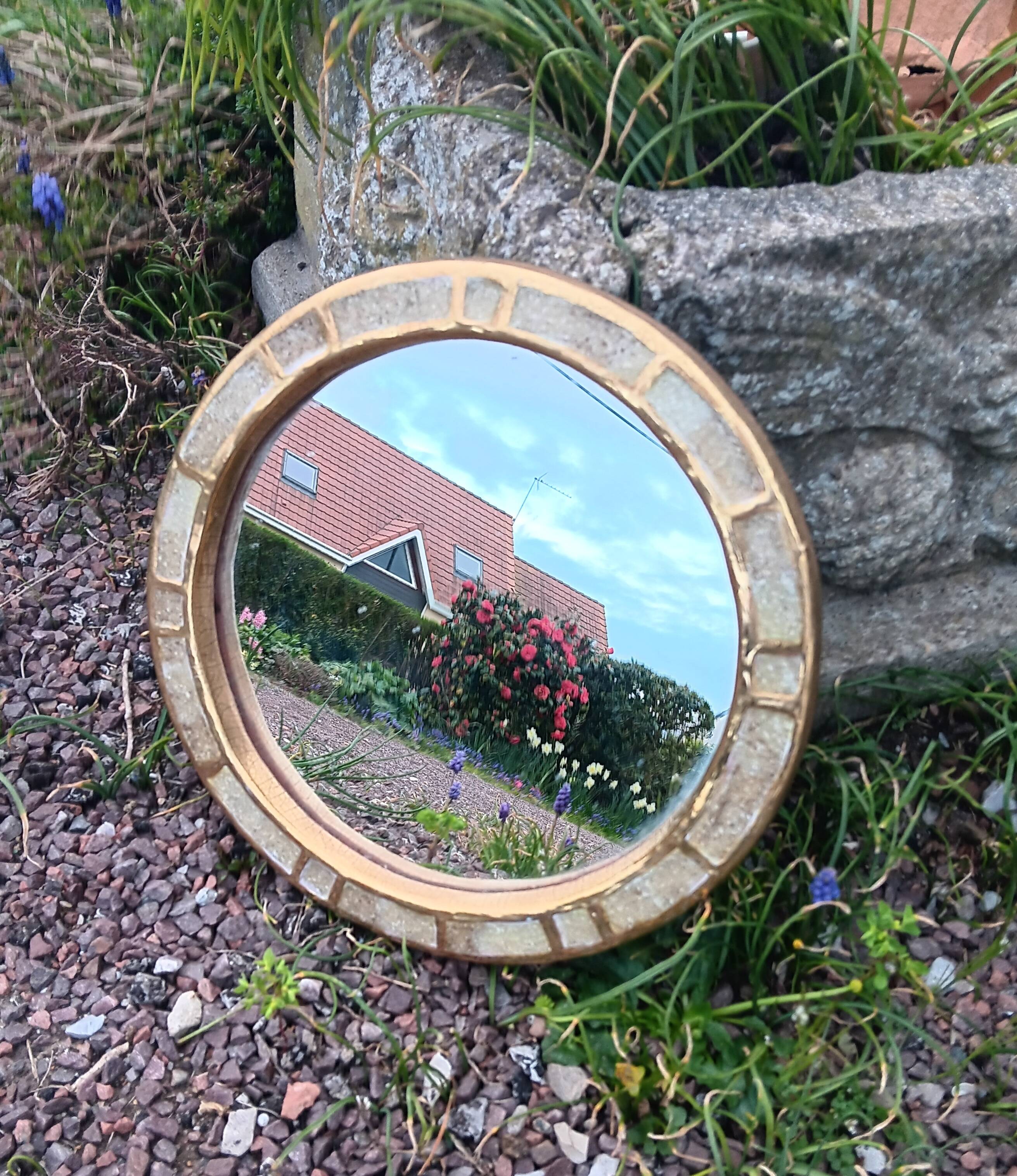 Ceramic mirror "gears" by Mithé Espelt