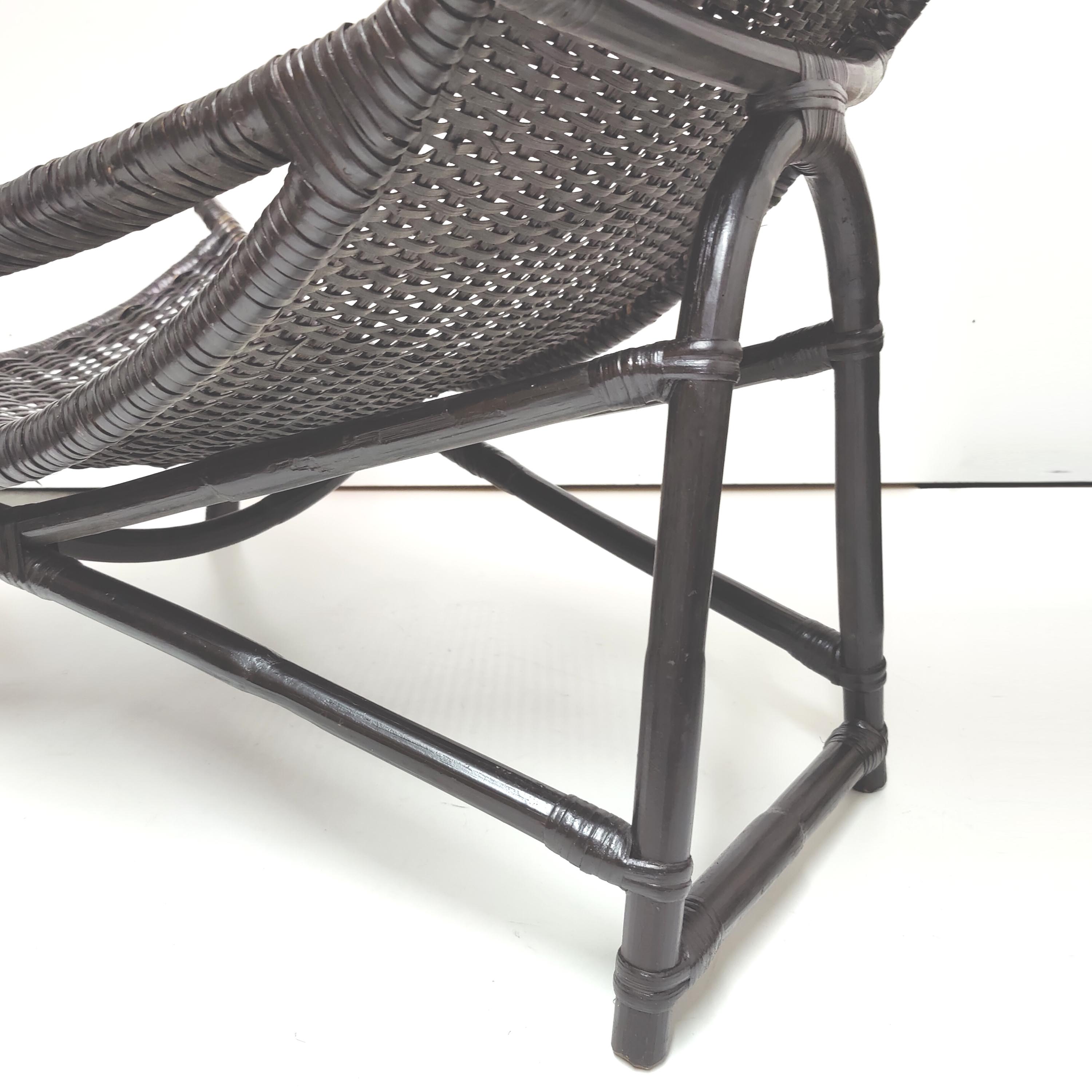 Vintage black rattan deck chair