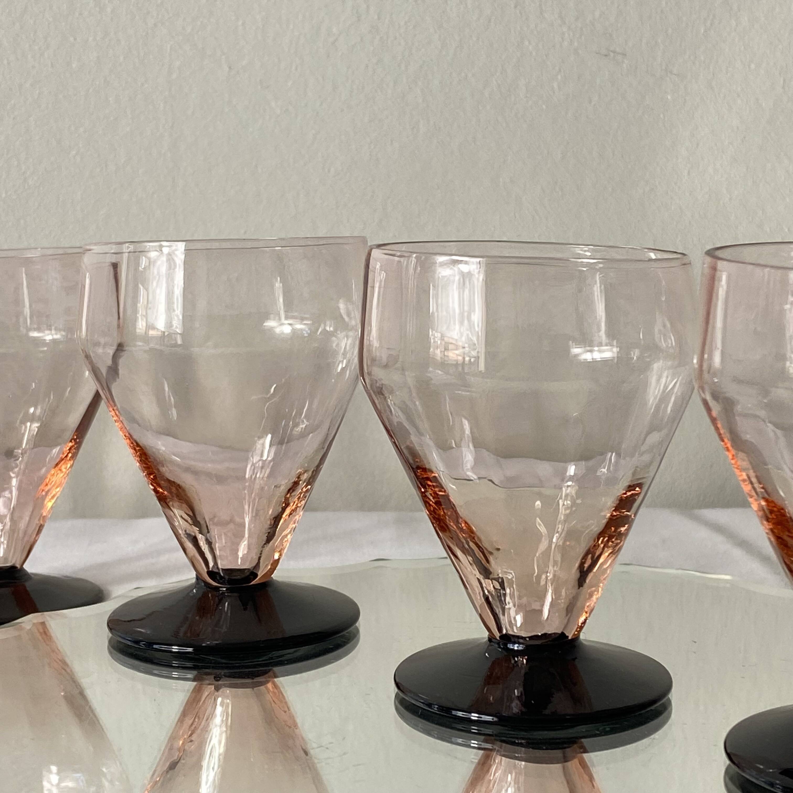 6 small Art Deco pink wine or water glasses with black stems.