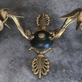 Antique bronze wall light with arm decorated with swans and palmettes in the Empire style