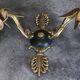 Antique bronze wall light with arm decorated with swans and palmettes in the Empire style