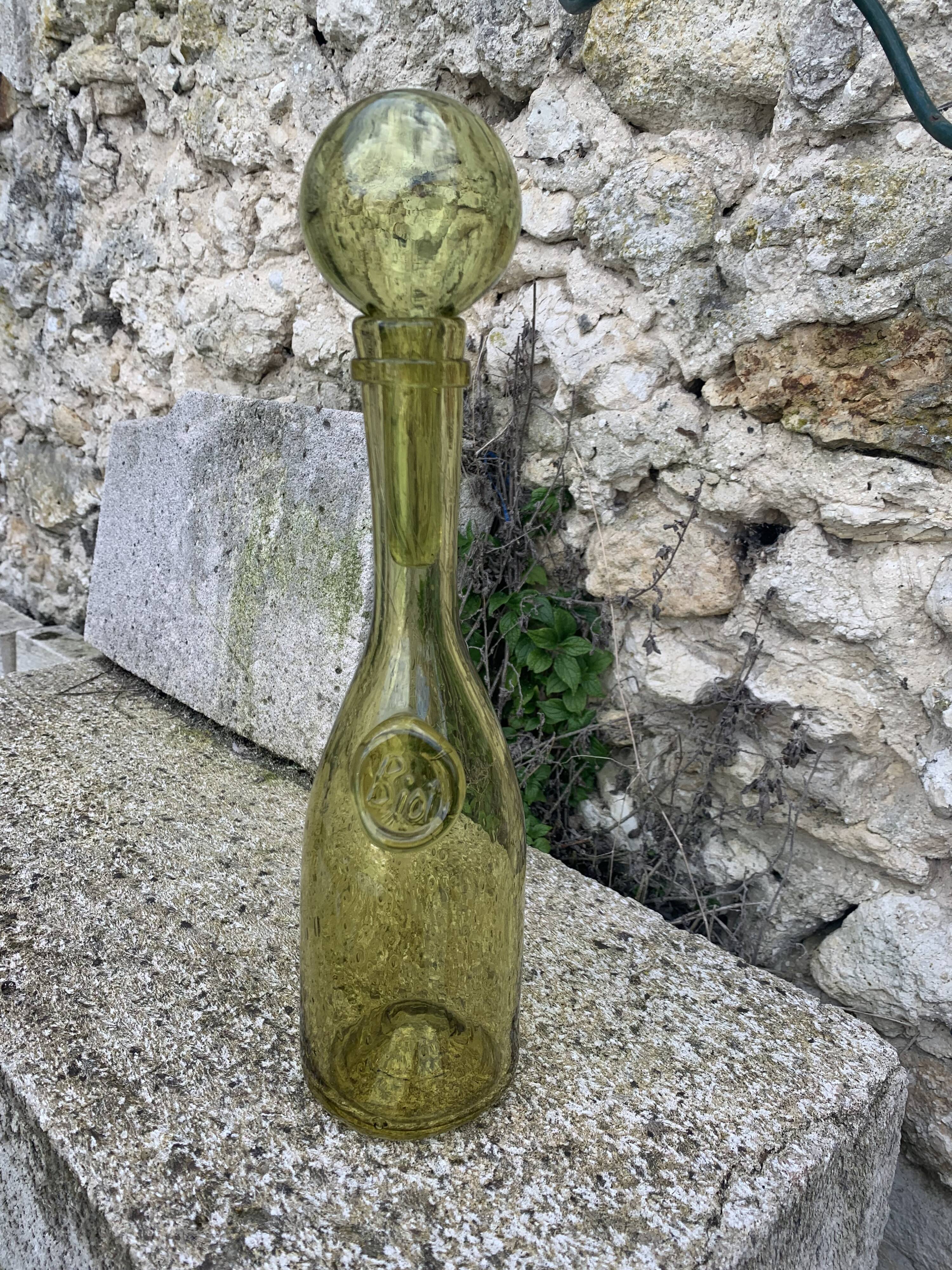 Glassblown glass decanter from the Biot collector glassworks