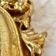 Antique oval mirror in gold leaf resin - baroque style - 73 cm