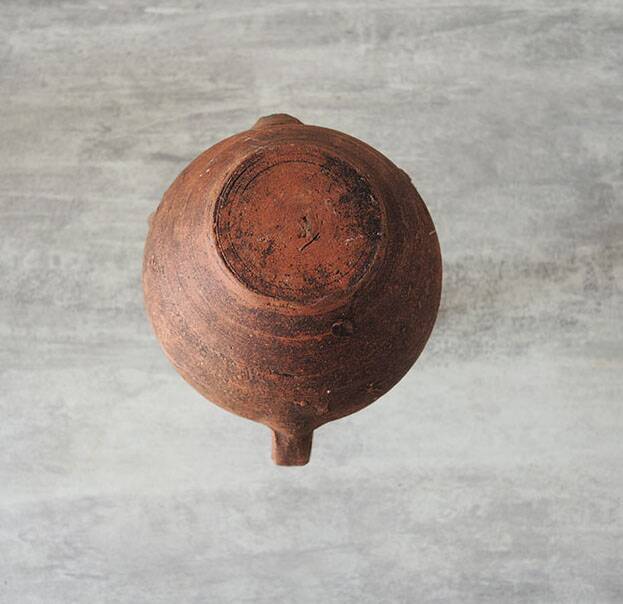 Old anthropomorphic terracotta vase pitcher