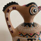 Clay pitcher with a bird head