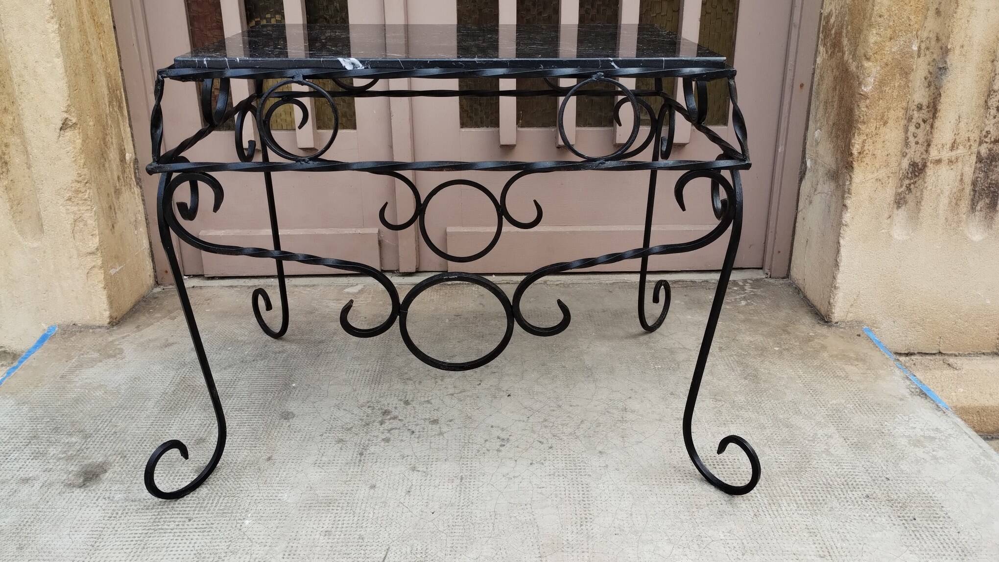 Wrought iron coffee table with black marble top