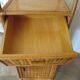 Storage column, wooden bookshelf and woven rattan.