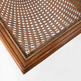 Side table with sculpted elements and rattan top