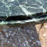 Oval coffee table in veined green marble
