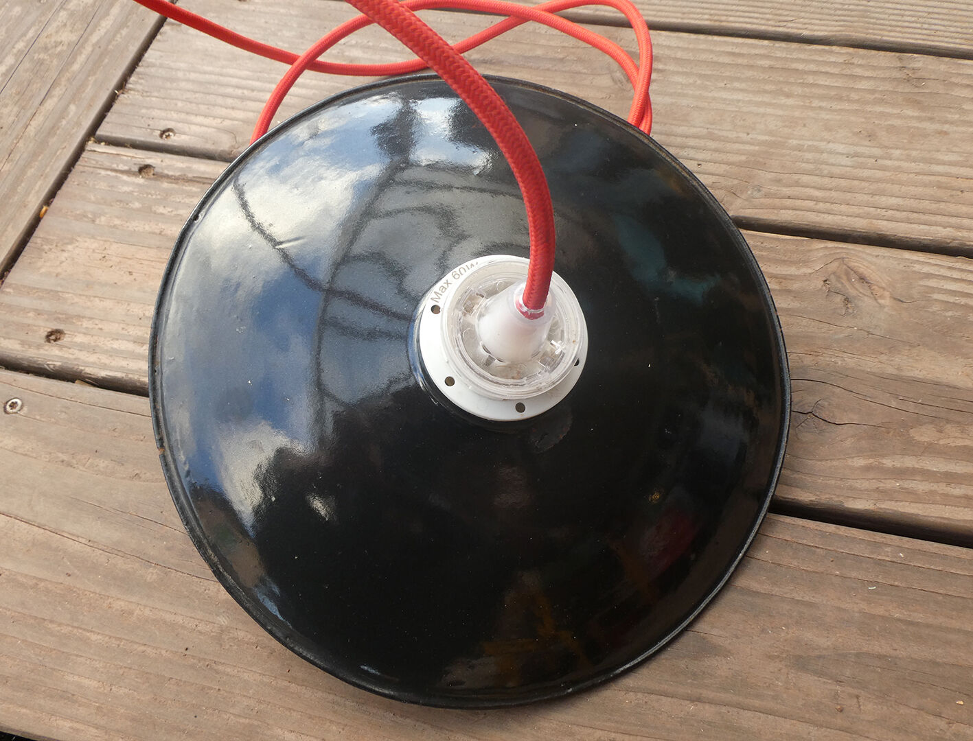 Black hanging lamp in enamelled sheet metal