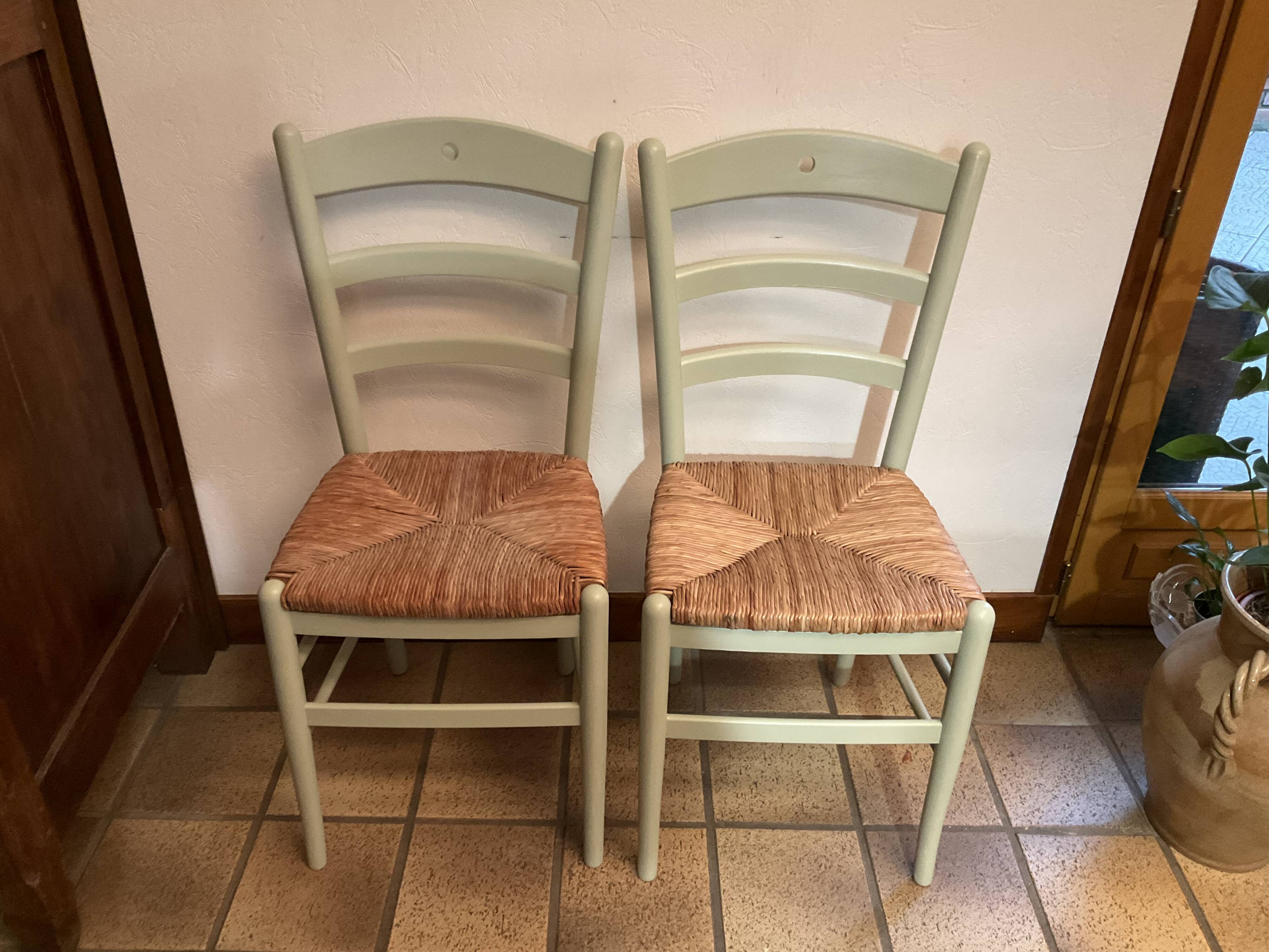 Pair of green straw sitting chairs