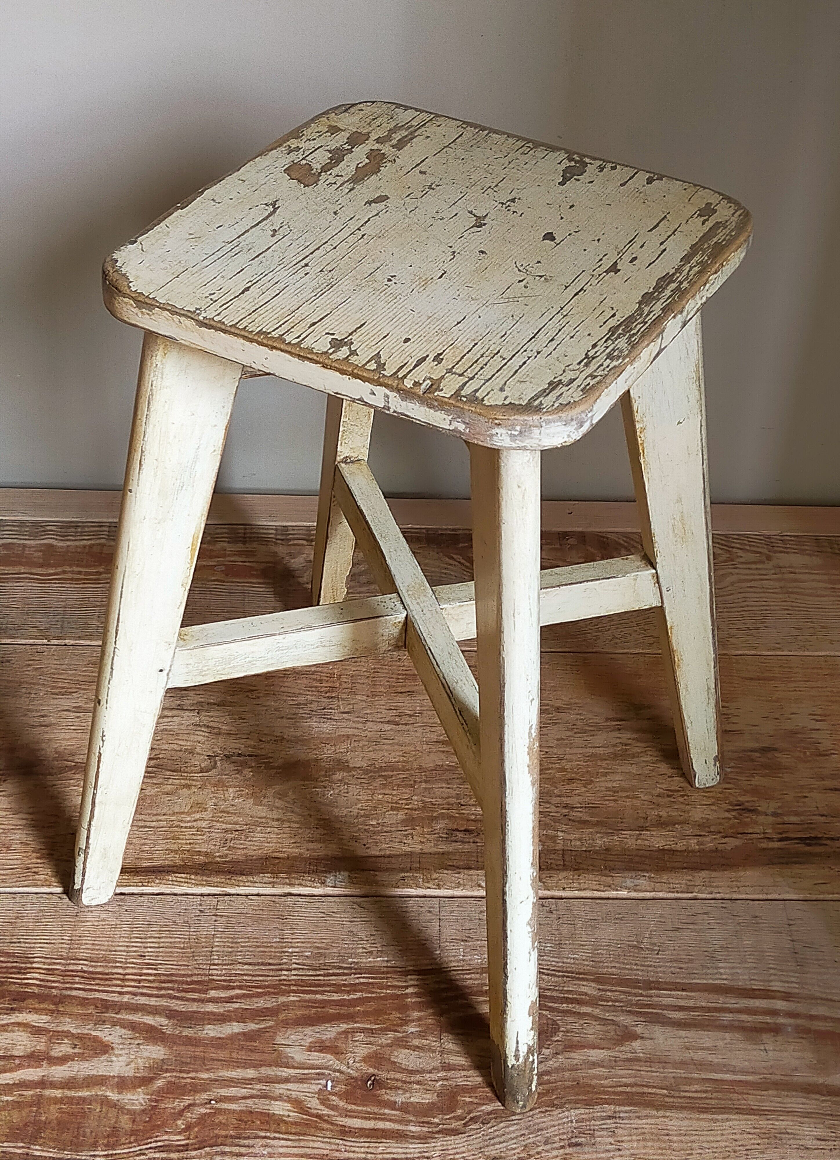 Old workshop stool in patinated solid wood