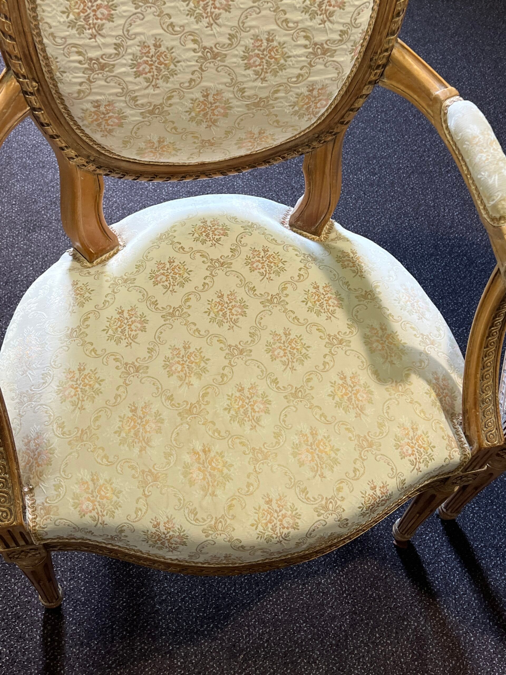 Pair of Louis XVI style armchairs, in solid walnut, re-edged and upholstered, pegged