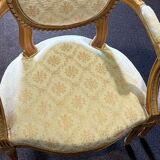 Pair of Louis XVI style armchairs, in solid walnut, re-edged and upholstered, pegged