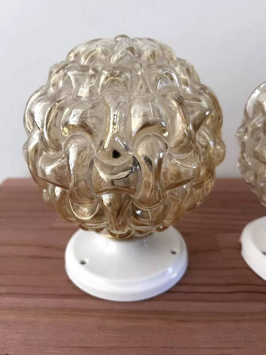 Pair of golden Scandinavian globe wall lights