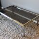 Table basse vintage en verre, laiton et chrome années 70