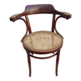 Caned chair with armrests attributed to Fischel
