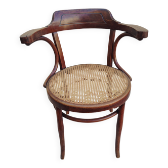 Chaise à accoudoirs cannée attribuée à Fischel