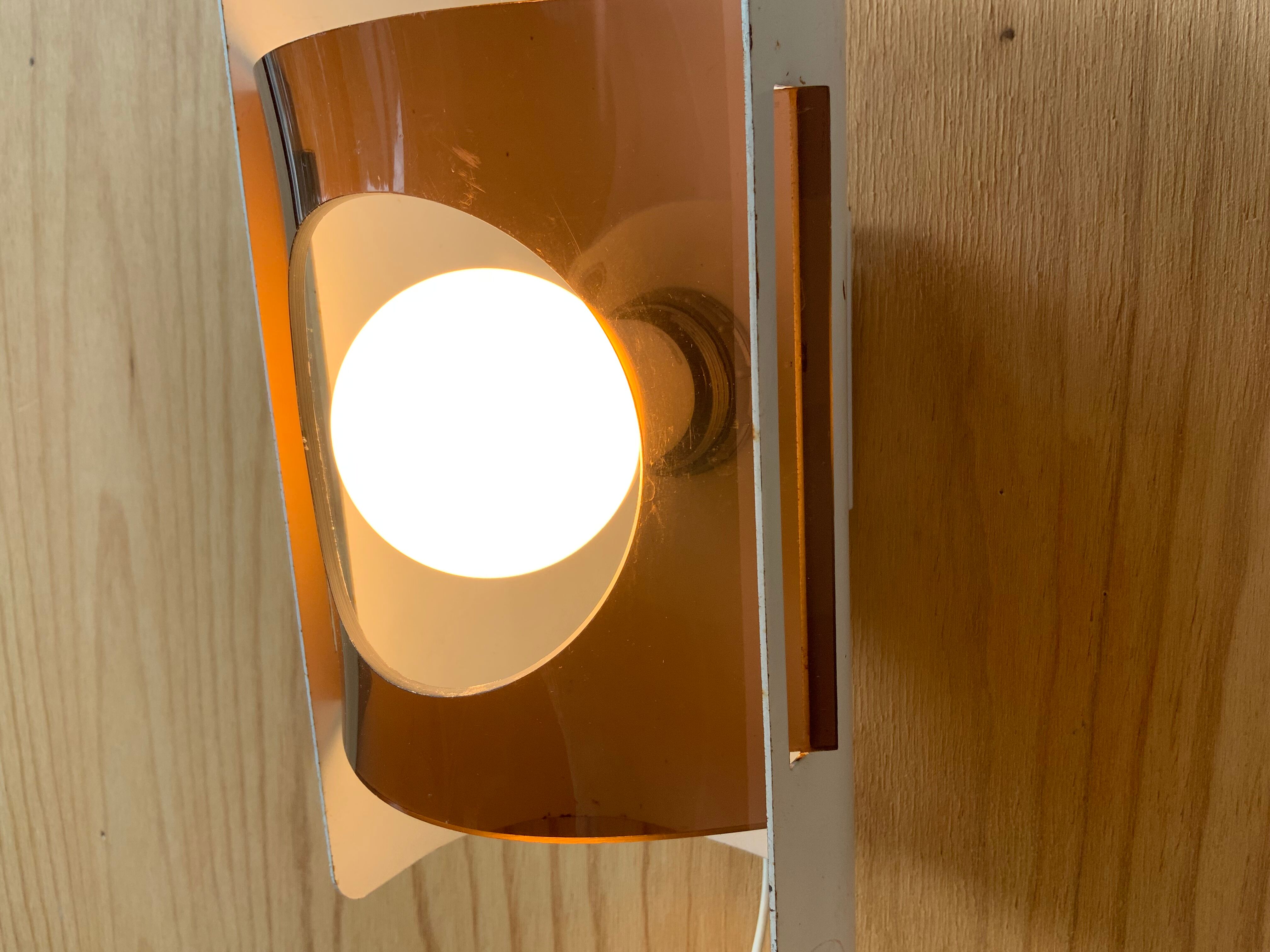 Plexiglas and metal wall lamp