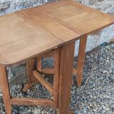 Old wooden table with double swings