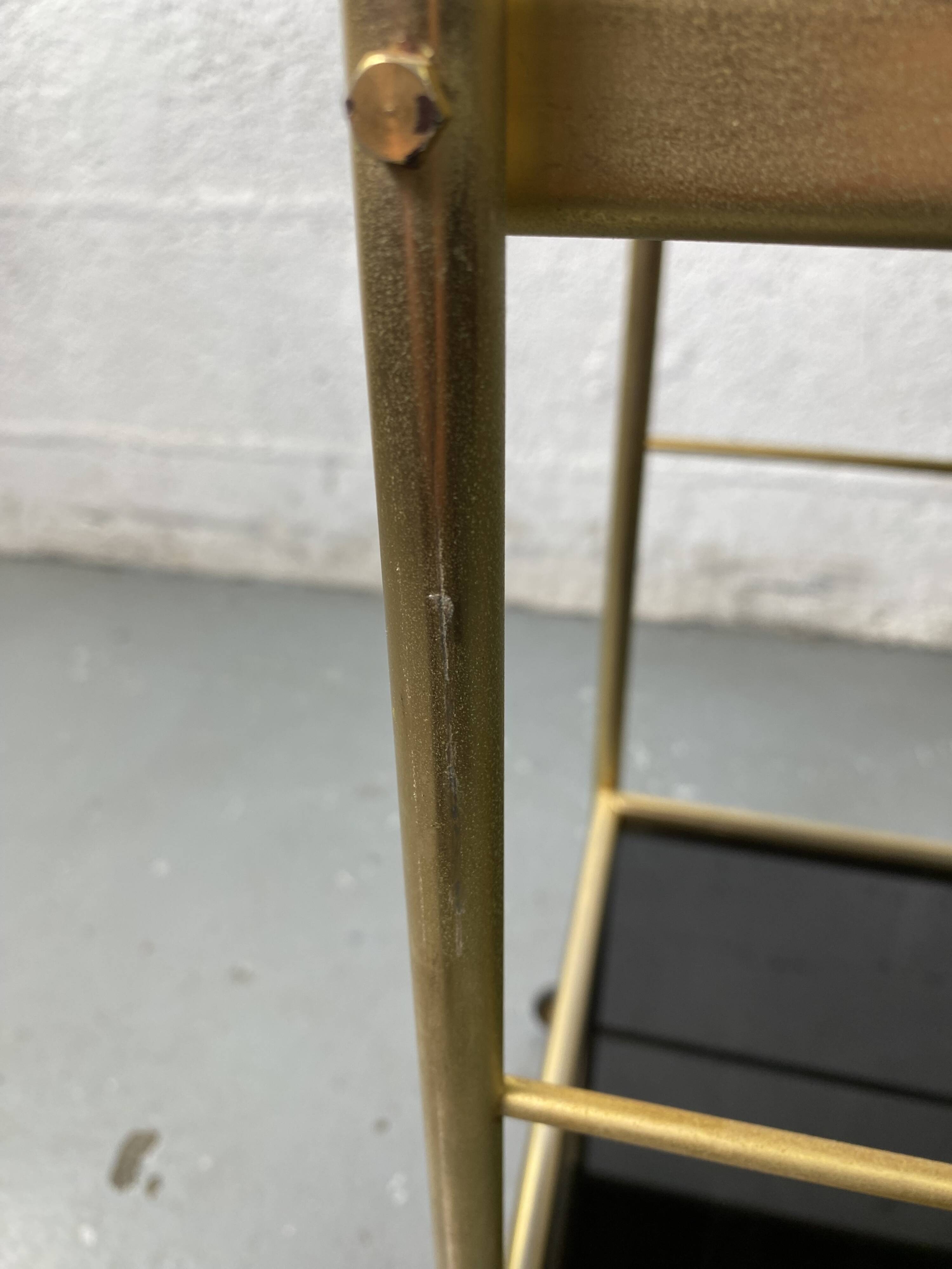 Small rolling trolley in brass and black plastic