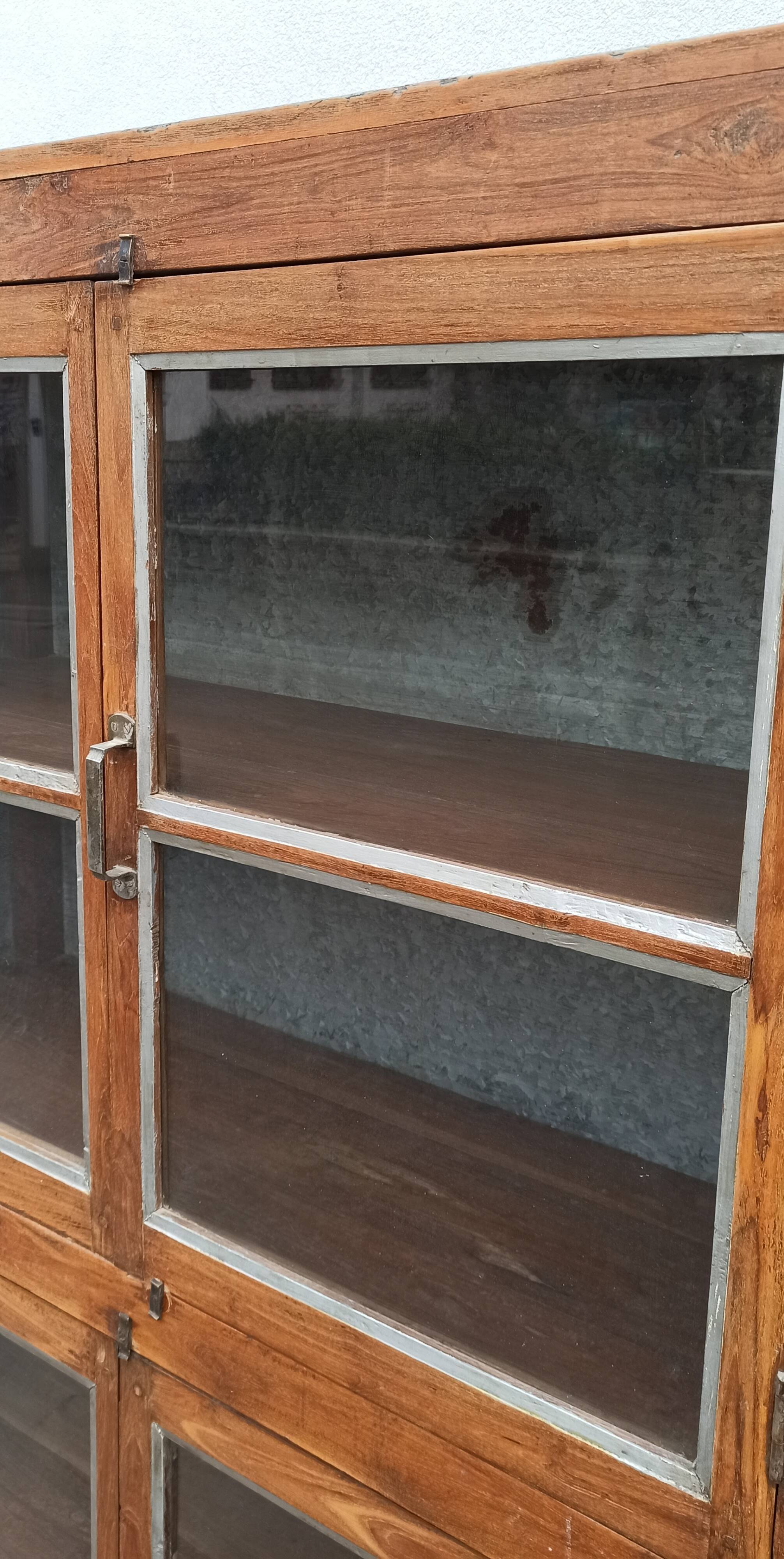 Old glass cabinet in wood and metal