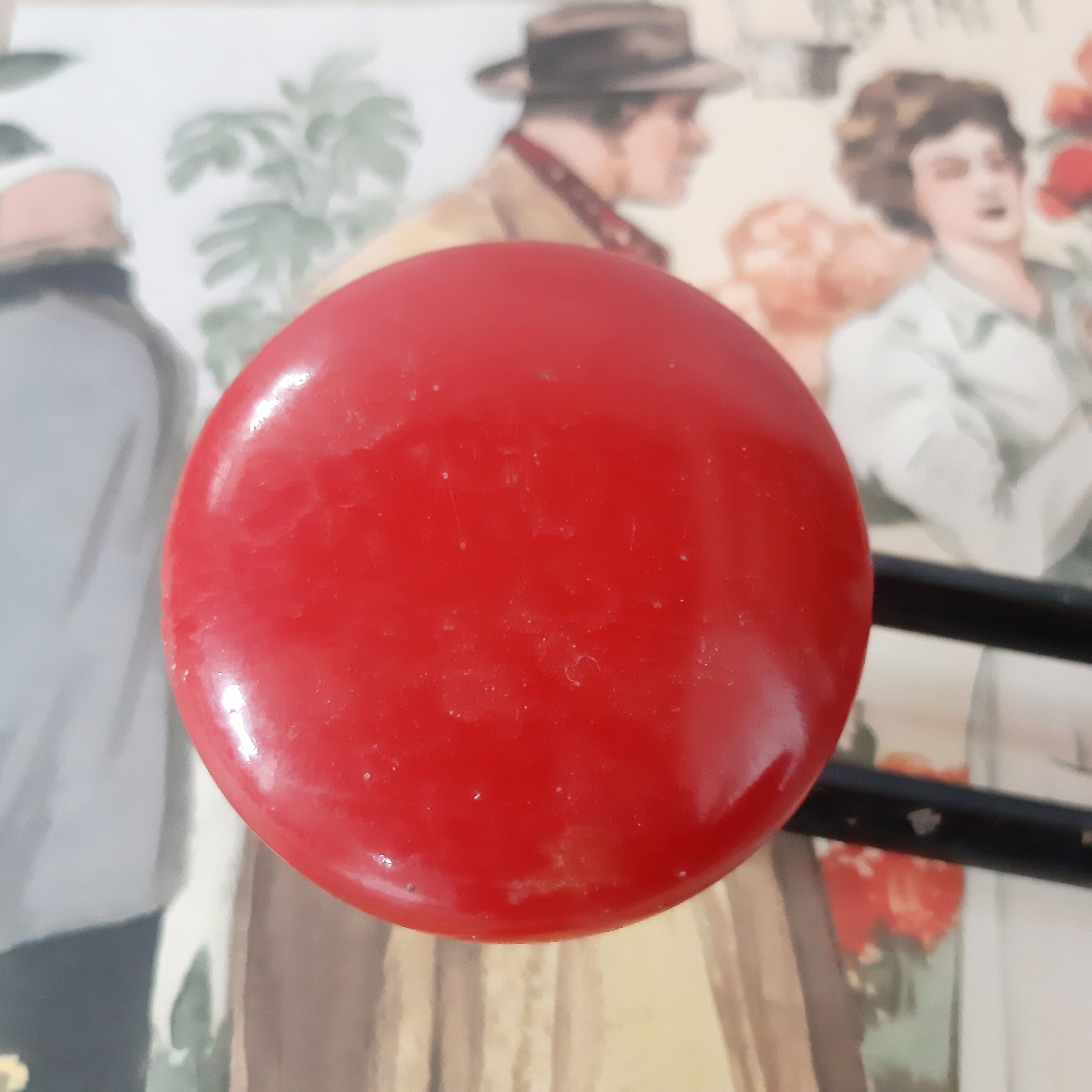Double red metal patère of the 1950s.