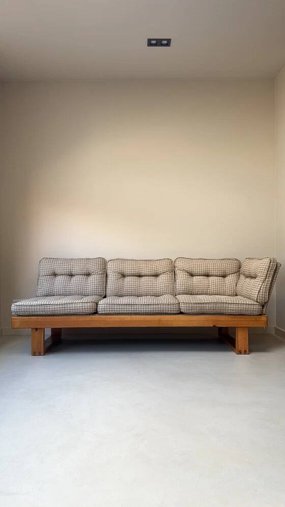 Two vintage Swedish sofas and a pine table