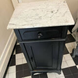 Chest of drawers with a white marble top.