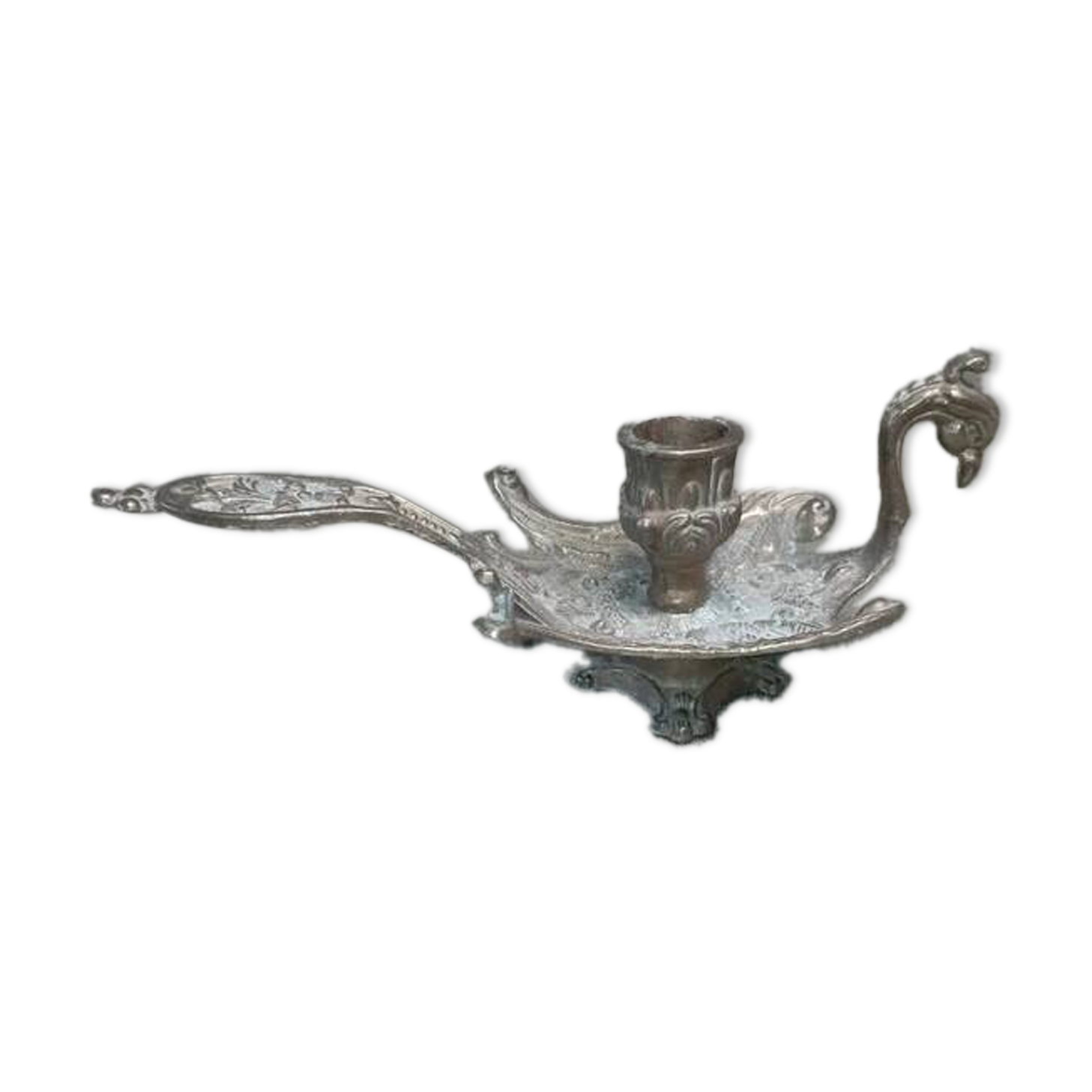 Chiselled brass candlestick in the shape of a peacock.