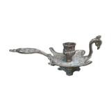 Chiselled brass candlestick in the shape of a peacock.