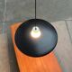 Minimalist metal and glass pendant lamp in mid-century style.