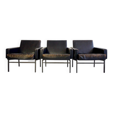 Set of three minimalist leather armchairs by COR.