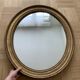Old oval golden mirror