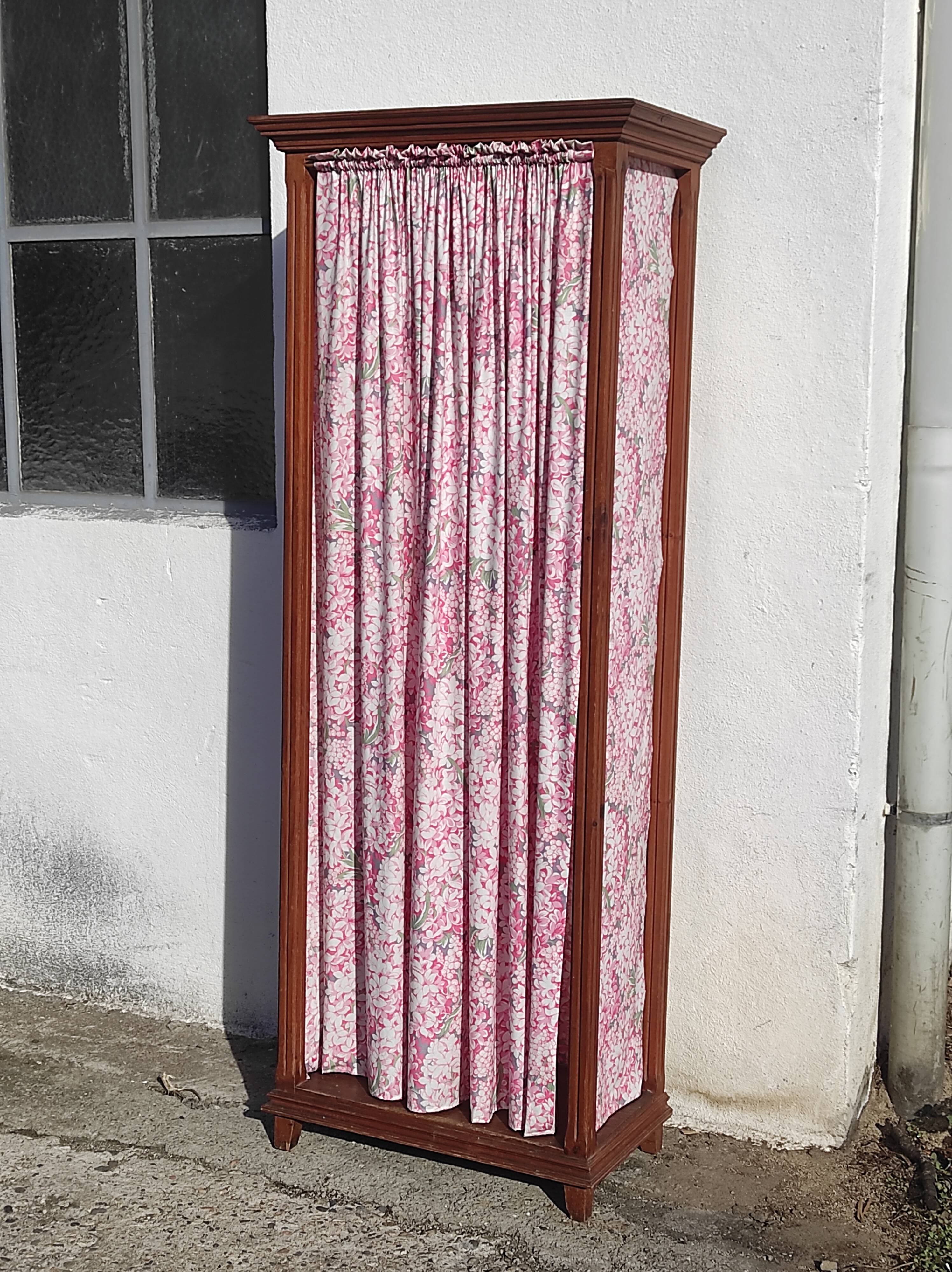Old wardrobe in old wood and vintage fabric