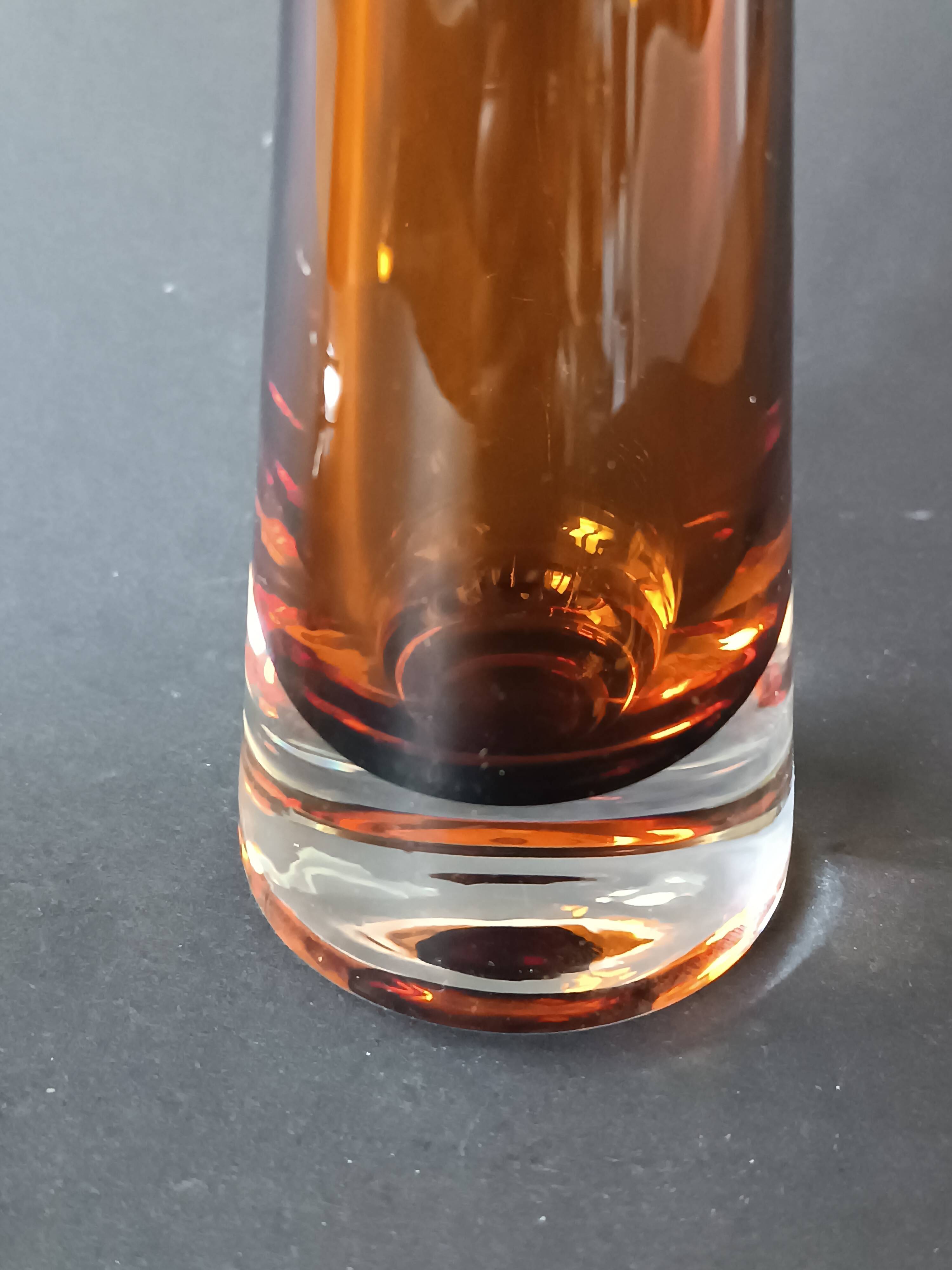 Two vintage Scandinavian double-layered amber blown glass candlesticks