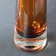 Two vintage Scandinavian double-layered amber blown glass candlesticks