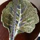 Vintage ceramic leaf-shaped vide poche, signed.