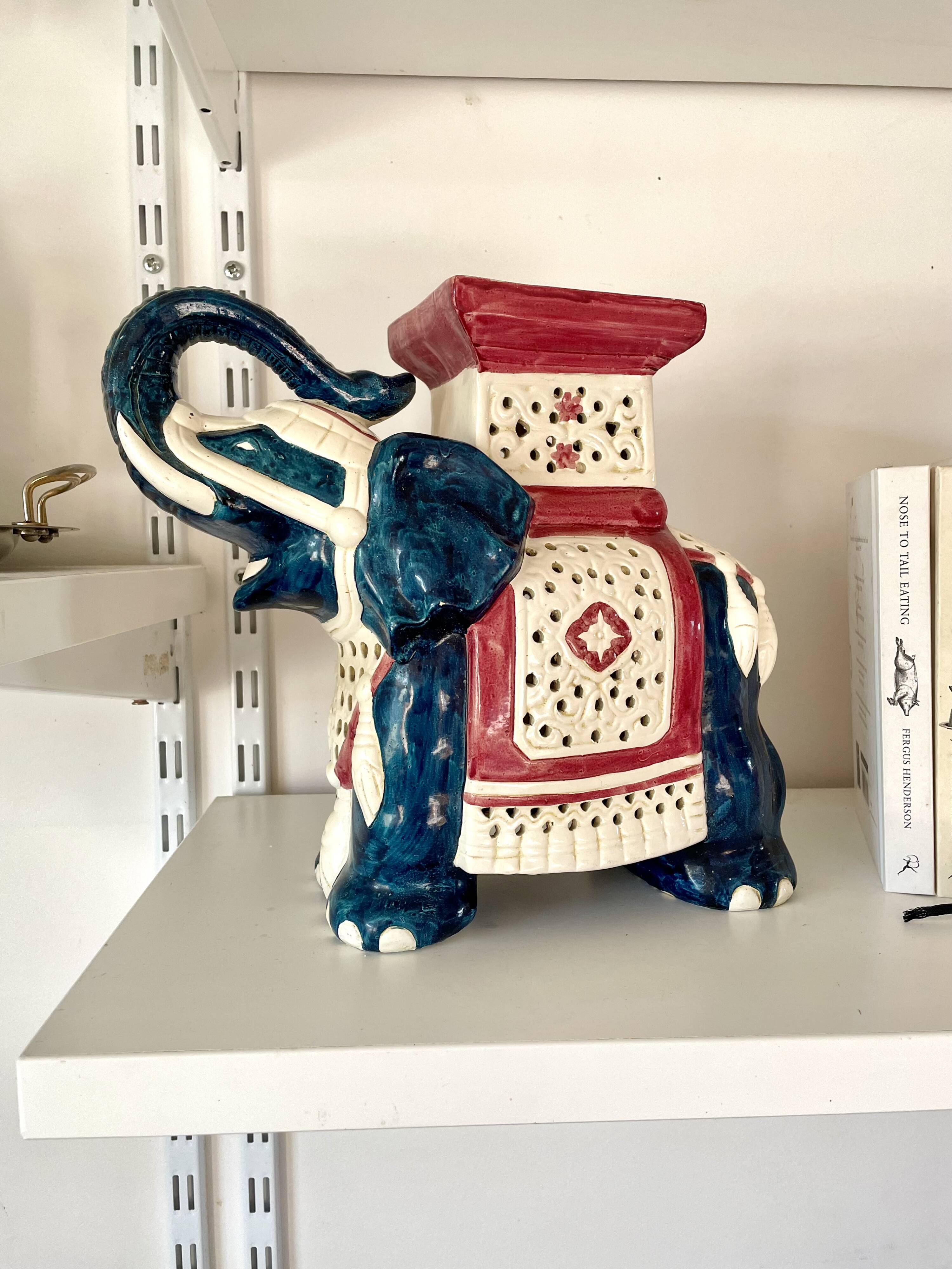 Blue and red ceramic elephant plant stand