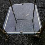 Small rolling table in glass and gold metal