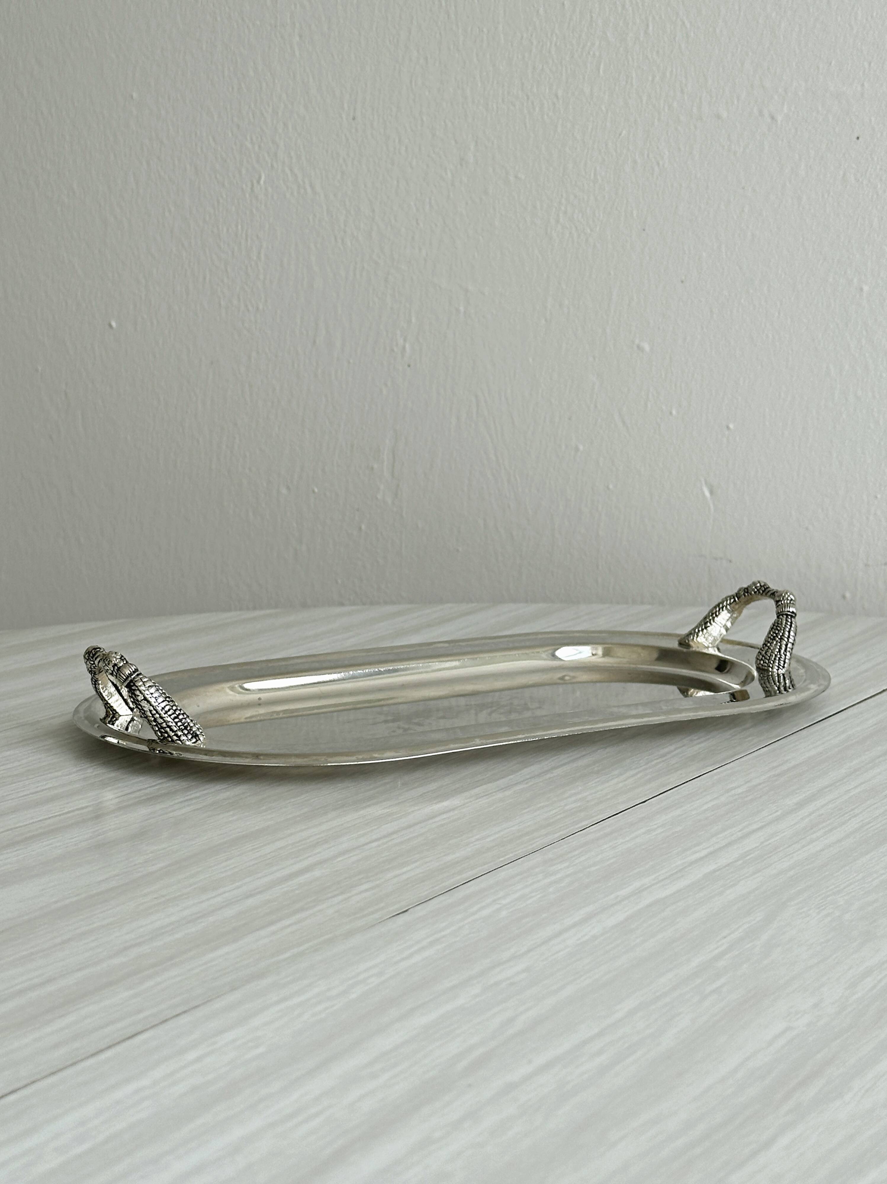 Vintage silver plateau with knot handles.