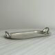 Vintage silver plateau with knot handles.