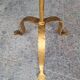 Minimalist brutalist gold metal pedestal table