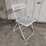 Perforated metal folding chair