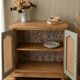 Renovated vintage sideboard in caning and sage green.