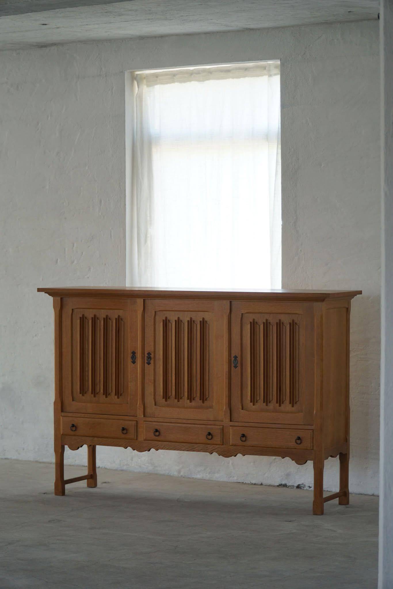 Brutalist oak sideboard, mid-century Danish design, Kjærnulf style, 1960s.